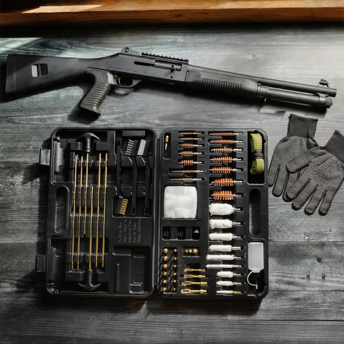 Pump shotgun above the open kit